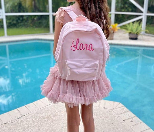 embroidered backpack that is personalized with the name Lara.